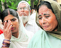 Kamla Devi, an employee of the club, in tears