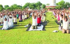 Inmates perform yoga and meditation in Karnal jail.