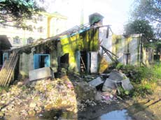 The dilapidated building of the tehsil office, which is yet to be dismantled, on the Mini-Secretariat premises in Kangra.
