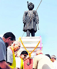 Members of the Duggar Vikas Manch pay homage to the statue of Maharaja Hari Singh at Tawi bridge in Jammu on Saturday