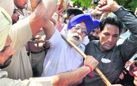 The police stops the protesters from blocking the road in Ludhiana on Saturday.