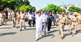Members of the Sarv Shiksha Abhiyan RMSA Non -Teaching Employees Union march towards Karabara Chowk on the GT Road in Ludhiana on Saturday.