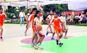 Players in action during a basketball match at Doraha Public School.