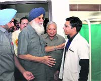 Chief Minister Parkash Singh Badal and Health Minister Madan Mohan Mittal (C) at the new hospital in Ghudha.