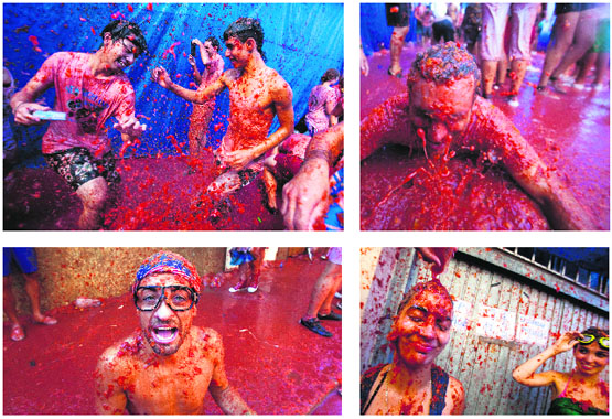 Revellers during the annual "tomatina" tomato fight fiesta in the village of Bunol, near Valencia recently. Tens of thousands of revellers hurled 120 tonnes of squashed tomatoes at each other, drenching the streets in red in a gigantic Spanish food fight known as the Tomatina.
