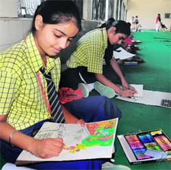 Students participate in a painting competition held to mark the Heritage Week celebrations in Amritsar on Sunday. 