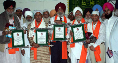 The recipients of the Baba Farid Award show the citation received on the concluding day of the Baba Farid Aagman Purb in Faridkot on Sunday.