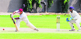 A player plays a shot during the 19th All-India JP Atray Memorial Cricket Tournament in Chandigarh on Sunday.