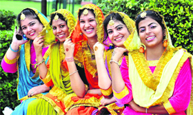 Students pose in traditional attire during the freshers day celebrations at the Swami Vivekanand Institute of Engineering and Technology in Banur on Sunday.