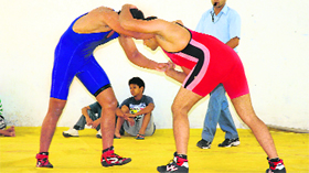 Wrestlers in action during the Senior State Wrestling Championship in Chandigarh on Sunday.