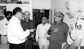 Members of the Commission for Governance Reforms interact with officials of the district administration in Fatehgarh Sahib on Sunday.