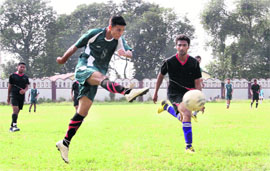 A match in progress during the Lala Nemi Dass Memorial Football League in Dehradun on Sunday. 