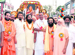 Saints and akhada heads participate in the 518th birth anniversary celebrations of Acharya Jagadguru Bhagwan Chandracharya Maharaj in Haridwar on Sunday. 