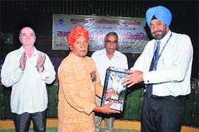 Lt-Gen DDS Sandhu, Vice-Chancellor of Kurukshetra University, honours World War-II veteran Barkha Ram in Kurukshetra on Sunday