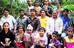Winners of the Inter-School Chess Championship pose with their trophies in Jammu on Sunday