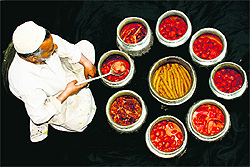 Wazas, Kashmiri chefs, are in great demand during the ongoing Haj pilgrimage and marriage season. They are famous for cooking wazwan during festive occasions and are hired months in advance due to their shortage