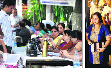A stall at a polling booth during the Panjab University Senate elections in Ludhiana on Sunday; and (right) voters wait for their turn to cast vote