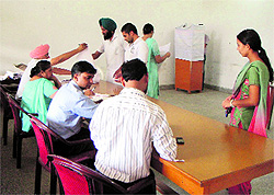 Voters cast their vote during the Panjab University Senate elections at Doraha on Sunday