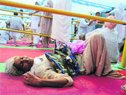 A patient lies on the floor in the absence of a wheelchair at the medical camp in Badal village of Muktsar. 