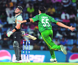 Umar Gul celebrates the wicket of Brendon McCullum in Pallekele on Sunday. 