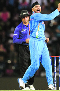 Harbhajan Singh exults after taking Eoin Morgans wicket in Colombo on Sunday. 