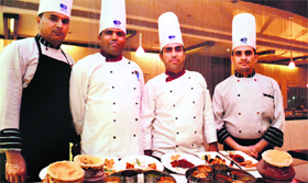 Chefs with their signature dishes