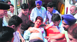 Rajan Sharma, who was injured in the firing incident, being taken to a hospital in Amritsar on Monday.
