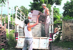 A family leaves Chandi Kotla village in Panchkula on Monday. a tribune photograph