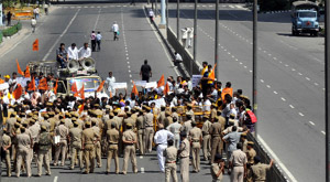 The Delhi police puts barricades on Vikas Marg at ITO during a demonstration held by the Bajrang Dal activists against its failure to protect Subhash Park and allowing an illegal structure on the wall of a Pandav-era temple found during the excavation by the DMRC in July this year, in New Delhi on Monday.