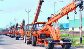 Several cranes being driven towards the ARTO office as a mark of protest in Haridwar on Monday