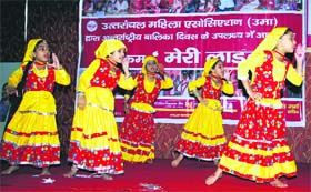 Girls perform at a programme to celebrate International Girl Child Day in Dehradun on Monday