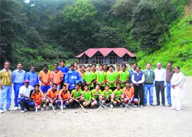 The winners of the inter-district hockey tournament in Mussoorie on Monday