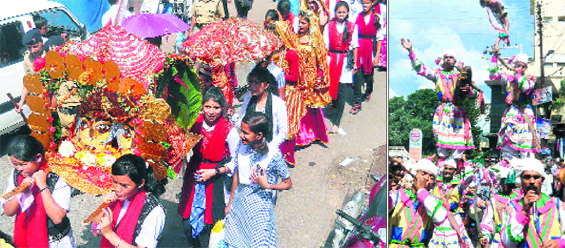 Girls carry idols of Nanda Devi in a procession in Almora on Monday; and (right) the traditional band performs during the celebrations. 