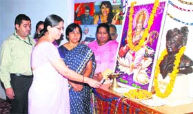 Deepti Dharmani, an associate professor in Chaudhary Devi Lal University, lights a lamp to inaugurate a quiz competition in JCD Polytechnic in Sirsa