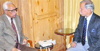 Governor NN Vohra interacts with Northern Army Commander Lt Gen KT Parnaik at Raj Bhawan in Srinagar on Monday. A Tribune photograph