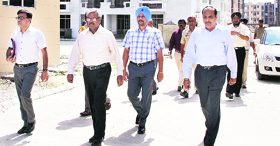 Local Bodies Director Ashok Gupta, along with officials of the Municipal Corporation and the Jalandhar Improvement Trust, at Nitishree Flats in Jalandhar on Monday.