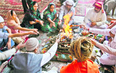 Devotees offer prayers during the 518th birth anniversary of Sri Chand at Chandra Udaseen temple in Srinagar on Monday. photo: Yawar kabli