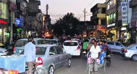 A view of the busy Ghumar Mandi area on Monday evening. 