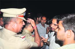Police officials try to persuade them to lift their dharna
