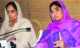 Wives of Kulbir Singh Barapind and Daljit Cheema at a press conference in Chandigarh on Monday.