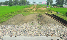 High-tension wires (encircled) hang precariously over the unfinished section of the Chandigarh-Ludhiana rail track