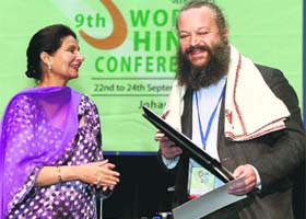 Marko Jolly of Italy with Preneet Kaur, Minister of State for External Affairs, at the 9th World Hindi Conference in Johannesburg, South Africa, on Monday