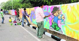 Artists make graffiti near the Sukhna Lake.