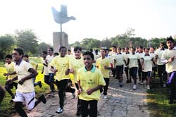 Children participate in a walk during the tourism week celebrations in Chandigarh on Tuesday. 
