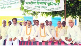 Peasants sit on an indefinite agitation under the aegis of the Bharatiya Kisan Union in Haridwar on Tuesday