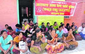 ASHA health workers hold a dharna in support of their demands in Pithoragarh on Tuesday