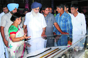 Punjab Chief Minister Parkash Singh Badal views the belongings of former Devi Lal after inaugurating the Tau Museum at Sirsa on Tuesday.