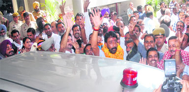 Newly appointed Mayor Sunil Jyoti waves to party workers before getting into his new official vehicle in Jalandhar on Tuesday. Tribune photos: Malkiat Singh