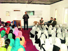 A clinical psychologist addresses women at a mental awareness programme in rural Kashmir. 