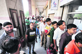 A long queue of consumers outside a LPG counter in Jammu on Wednesday.